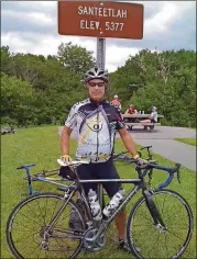  ?? CONTRIBUTE­D ?? After undergoing heart surgery in 2000, Il Giallo chefowner Jamie Adams took up cycling. “It’s a way to clear your head,” Adams said. “It’s just you, the bike and the road.” Here, Adams poses after summiting a 27-mile climb in Santeetlah, N.C.