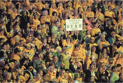  ?? ANDREW NELLES / TENNESSEAN.COM ?? Predators fan cheer during the first period of the divisional semifinal game at Bridgeston­e Arena in Nashville on April 13, 2019.