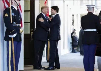  ??  ?? United States President Donald Trump welcomes Canadian Prime Minister Justin Trudeau outside the White House on Monday.