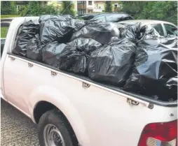  ??  ?? The black sacks filled with rubbish after the clean-up