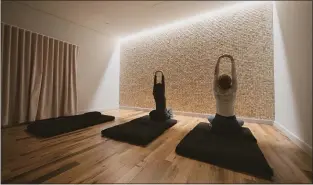  ??  ?? Employees stretch in a meditation room at the Nuts.com headquarte­rs.