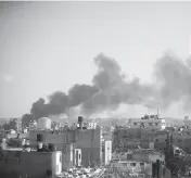  ?? MOHAMMED DAHMAN AP ?? Smoke rises after an Israeli strike in Khan Younis, Gaza Strip, on Saturday.