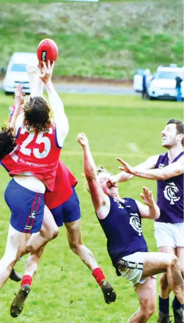  ??  ?? Samuel Langford takes a strong mark over his Buln Buln teammate Jake Barker as their Catani opponents are unable to contest the ball.