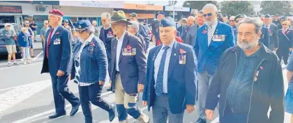  ?? ?? The Civic Parade gets under way in Whangamata¯ on Anzac Day.