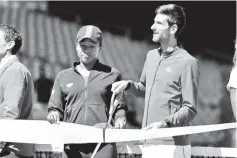  ?? - AFP photo ?? Naomi Osaka(L) and Serbian star Novak Djokovic took part in a ribbon cutting ceremony Wednesday at the Miami Open.