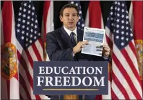  ?? MATIAS J. OCNER — MIAMI HERALD VIA AP, FILE ?? Florida Gov. Ron DeSantis speaks during a news conference at Christophe­r Columbus High School in Miami on Monday, March 27, 2023.