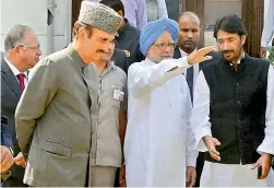  ?? — PTI ?? Former prime minister Manmohan Singh with senior Congress leader Ghulam Nabi Azad arrives for an executive committee meeting in Srinagar on Saturday.