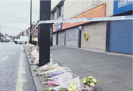  ??  ?? Floral tributes left outside the One Stop store in Sea Road, Fulwell, following the death of Joan Hoggett.