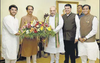  ?? PTI ?? (From left) Aditya Thackeray and Shiv Sena president Uddhav Thackeray, BJP president Amit Shah, Maharashtr­a CM Devendra Fadnavis, and state BJP chief Raosaheb Danve in Mumbai on Sunday.