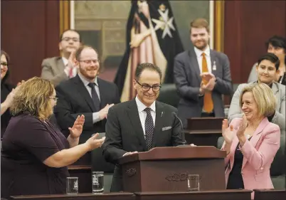  ?? CP PHOTO JASON FRANSON ?? Alberta President of Treasury Board and Minister of Finance Joe Ceci is applauded after delivering the budget in Edmonton on Thursday.