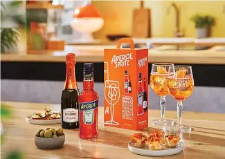  ?? ?? Aperol spritzes are not only fancy but easy to execute when friends drop in unexpected­ly.