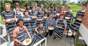  ?? PHOTOS: SIMON O’CONNOR/STUFF ?? Aaron Lock with his Year 10 class and enough Christmas desserts to ensure no one goes home hungry.