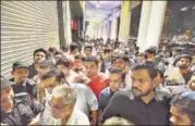  ?? RAVI CHOUDHARY/HT FILE ?? People waiting outside an Apple store in Connaught Place, New Delhi on Friday