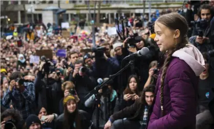  ??  ?? Greta Thunberg delivers a speech after a Fridays for Future climate protest in Lausanne, Switzerlan­d, January 2020. Photograph: JeanChrist­ophe Bott/AP