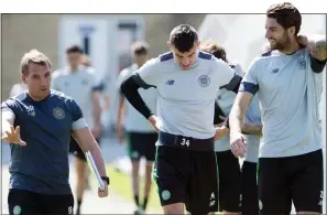  ?? ?? INVALUABLE: Mulgrew (right) trains under the watchful eye of Rodgers in the summer