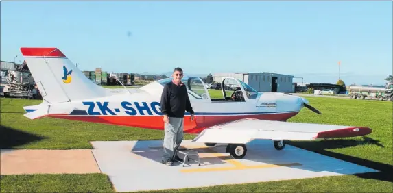  ??  ?? GRAHAM Gimblett with his Pioneer 300 Microlight aircraft just before delivery to the South Island.