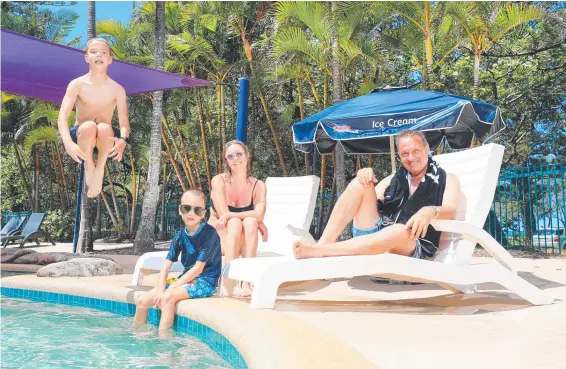  ??  ?? Sydneyside­rs Dino Pesce with wife Amanda and kids Archie, 9, and Oli, 7, enjoy the pool at Main Beach Caravan Park. Picture: Scott Powick