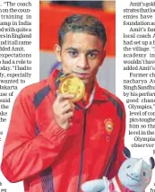  ?? PTI ?? Amit Panghal with his gold medal.