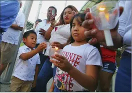  ?? JOEL MARTINEZ — THE MONITOR VIA AP ?? Valeria Ramirez, 6, listens to speeches along with the rest of her family during a vigil for Óscar Alberto Martínez and his daughter, Valeria, in McAllen, Texas, on Sunday.