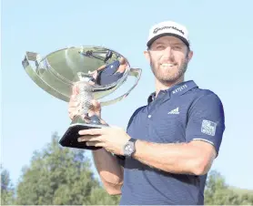  ??  ?? Dustin Johnson celebrates with the FedEx Cup Trophy after winning in the final round of the TOUR Championsh­ip at East Lake Golf Club on September 07, 2020 in Atlanta, Georgia. - AFP photo