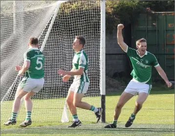  ??  ?? Colm Kehoe (right) celebrates after David Doyle-Murphy (5) scored the crucial Cloughbawn goal.