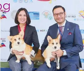  ??  ?? PCCI president Augusto Benedicto Santos III with wife Trish, and their two prized corgis Libby and Tai