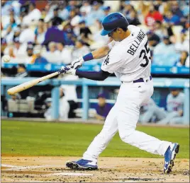  ?? Jae C. Hong ?? The Associated Press Cody Bellinger hits a two-run home run against the Mets on Tuesday. He is the first rookie to hit 10 homers in 10 games, according to Elias Sports Bureau.