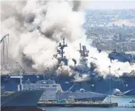  ?? DENIS POROY AP ?? The Bonhomme Richard burned at Naval Base San Diego last week, sending large plumes of smoke into the air.