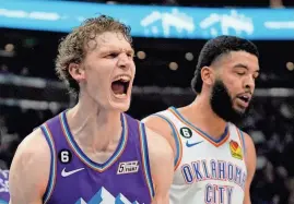  ?? City. AP PHOTO/RICK BOWMER ?? Utah Jazz forward Lauri Markkanen, left, reacts after a dunk against the Oklahoma City Thunder during the second half of a 120-119 win Thursday in Salt Lake