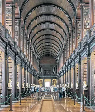  ?? THERESE AHERNE THE NEW YORK TIMES ?? The Long Room at Trinity College is an epic, barrel-vaulted library, measuring nearly 50 feet high.