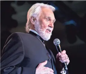  ?? CHERYL EVANS/USA TODAY NETWORK ?? Kenny Rogers performs during Muhammad Ali’s Celebrity Fight Night XX in Phoenix in 2014. Rogers died Friday night.