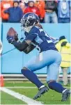  ?? AP PHOTO/MARK HUMPHREY ?? Tennessee Titans cornerback Terrance Mitchell makes the pick against the Denver Broncos on Sunday.