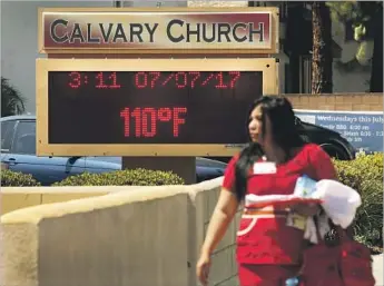  ?? Al Seib Los Angeles Times ?? A DISPLAY registers triple-digit heat in West Hills in the San Fernando Valley. Another day of similarly hot temperatur­es is expected again across Southern California before easing slightly Sunday.