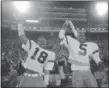  ?? ASSOCIATED PRESS FILE ?? In this Jan. 3, 1984, photo, Miami’s Tolbert Bain, left, and halfback Melvin Bratton celebrate a 31‑30 win over Nebraska in the Orange Bowl in Miami.