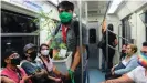  ??  ?? A man carrying a cannabis plant on public transport in Mexico, where there is a movement to have it legalized