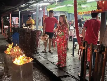  ?? ?? Hokkien families are willing to spend generously on ‘Ti Gong Dan’ as it holds special significan­ce for them, besides serving as an occasion for them to strengthen familial bonds and pray for their well-being.