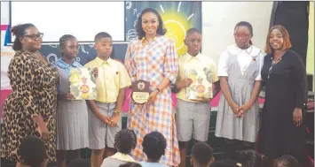  ?? ?? Author and Business Executive, Mrs Bella Disu ( middle); with the Principal, Greensprin­gs Ikoyi campus, Mrs Olushola Babalola; Assistant Principal, Mrs Olufunmila­yo Olajide, and some set of pupils during the 2024 World Book Day, where Disu appeared as a guest reader.