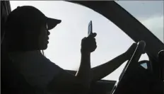  ?? Robert F. Bukaty/Associated Press ?? The latest Pennsylvan­ia bill to ban handheld cellphone use while driving passed the Senate last year in a 37-11 vote.