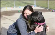  ?? CHARLES PRITCHARD — ONEIDA DAILY DISPATCH ?? Shelter Manager Sabrina Wilcox gets a kiss from Zoey after taking her out for some fresh air on Dec. 20, 2018.