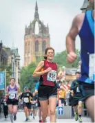  ??  ?? On he run Paisley’s iconic Coats Memorial Church was a magnificen­t backdrop as the runners pounded through Pailsey