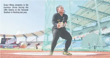  ??  ?? Grace Wong competes in the hammer throw during the 18th Sukma at the Sarawak Stadium in Kuching last year.