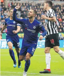  ?? OWEN HUMPHREYS/THE ASSOCIATED PRESS ?? Chelsea’s Eden Hazard, centre, celebrates after scoring in a 2-1 win over Newcastle in English Premier League action Sunday at St James’ Park in Newcastle, England.