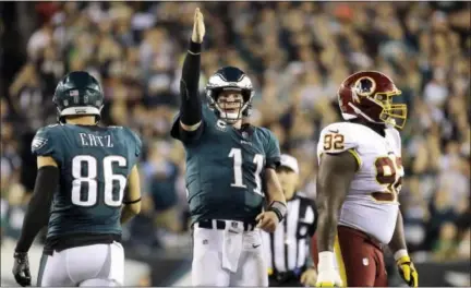  ?? MICHAEL PEREZ — THE ASSOCIATED PRESS ?? Philadelph­ia Eagles quarterbac­k Carson Wentz (11) gestures after scrambling for a first down during the second half of Monday night’s game against the Washington Redskins.