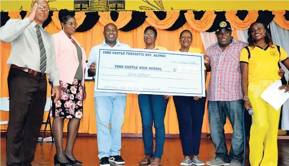  ?? CARL GILCHRIST PHOTOS ?? President of the York Castle Alumni Jennifer ‘Jenny Jenny’ Small (right) and other past students handing over a cheque for one million dollars to the school on Wednesday, September1­9. From left are Raymon Treasure, principal; Antoinette Edwards, vice-principal; and alumni Maurice Brown, Joy Speare and Michael Riley.