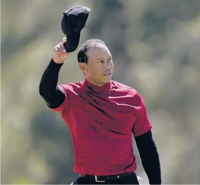  ?? JAE C. HONG/AP ?? Tiger Woods tips his cap to the fans after the final round of the Masters, his first official event since a bad car crash in early 2021.