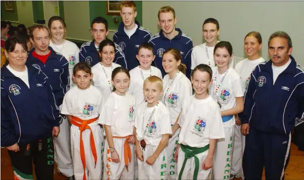  ??  ?? Members of the Cobra Kan Kick Boxing Team who competed at the WKA World Championsh­ips held in Killarney in 2003. Included in the picture are (Front L-R) Catherine O’Grady, Nadine Hughes, Conor Hernon and Niall Dorr. (Back L-R) Patricia McQuillan, Chief Irish Referee and Instructor, Bernard Duffy, Instructor and Fighter, Kim McQuillan, Richard McDonald, Catherine Brady, David Matthews, Andrew McDonald, Gerard Taaffe, Niamh Higgins, Shane Hutchinson, Lorna King, Catherine Doyle, Bernard Hutchinson, Referee. Missing from the picture were Karen Shaw and Marion Kierans, Referee.