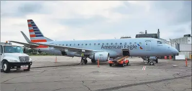  ?? Contribute­d / AvPORTS / ?? An American Eagle Embraer E175 regional jet, just arrived from Philadelph­ia, parked on the tarmac at Tweed New Haven Regional Airport on Sept. 12, 2019.