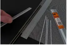  ??  ?? The track bed is cut and bent from aluminium mesh with the aid of a steel rule to form the folded sides. Styrene strip is used to make the longitudin­al girders which are glued to the sides of the track bed.