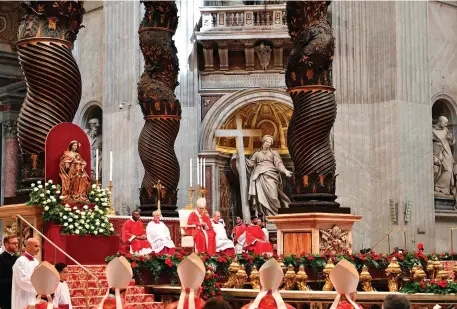  ??  ?? Pope Francis (centre) leads a Pentecost Mass yesterday at St Peter’s Basilica in the Vatican. Photo: AFP/ Vincenzo Pinto/Getty