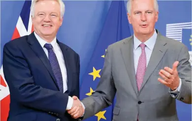  ??  ?? ‘Interrogat­ion’: Brexit Secretary David Davis and EU chief negotiator Michel Barnier